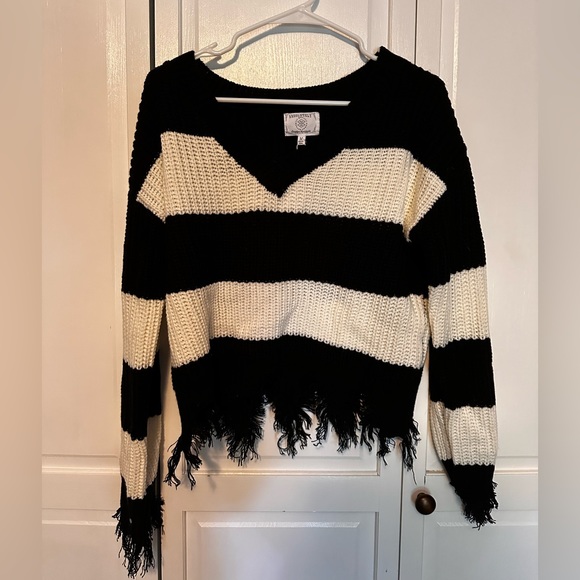 Black and white Sweater. Brand new. Size medium. Fringe sleeves and hem. - Picture 2 of 5